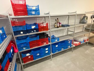 many baskets on the shelves in the store