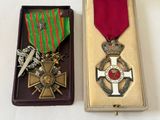 two medals sitting in a box on a table
