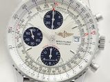 a close up of a watch on a white surface