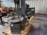 a machine that is sitting on a pallet in a warehouse