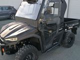 an image of a utility vehicle parked in front of a building