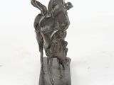 statue of a man on a horse with a bird on its back