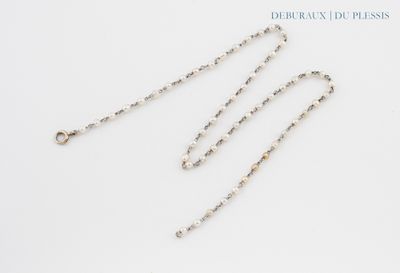 a close up of a chain on a white surface