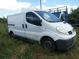 a white van that is parked in the grass