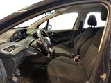 the interior of a car with the door open and the steering wheel down