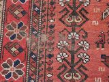 an image of a close up of a rug with a red background