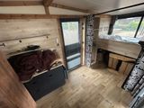 a room with a bed and a desk in it