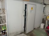 a room with two doors and a ladder in it