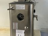 a machine that is sitting on a counter in a kitchen