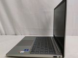 an open laptop computer sitting on top of a white table