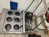 a picture of a kitchen with a stove and a hand truck