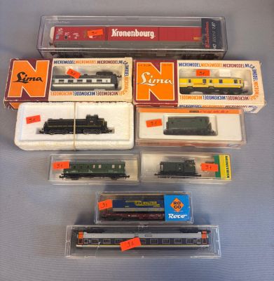 many different types of toy trains in the box