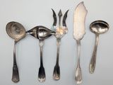 five spoons and two spoons on the table