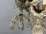 a chandelier that has a bunch of beads hanging from it