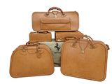 several pieces of luggage sitting on top of each other on a white surface