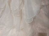 a white dress with ruffles on a mannequin mannequin mannequin mannequin mannequin mannequin mannequin