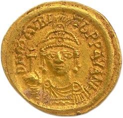 une pièce d'or portant l'image d'un homme