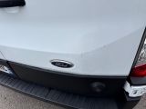 a close up of the rear end of a white truck