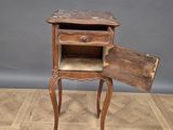 an old wooden table with a drawer on top of it