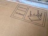 a cardboard box with a picture of a router on it