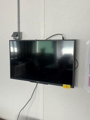 a flat screen tv mounted on a wall in a room