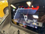 a close up of a car dashboard with a digital display on it