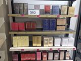 many boxes of perfume on the shelves in the store