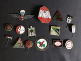 many different types of badges on a black surface