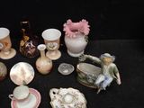 many different types of vases and bowls on the table
