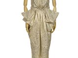 an image of a mannequin dressed in a gold dress on a stand