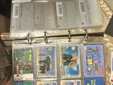 a lot of cards in the case on the table