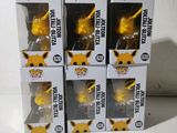 a close up of four boxes of pokemon pop vinyl figures