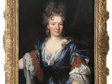 a painting of a woman in a blue dress holding a black cat