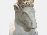 a statue of a sheep with a crown on its head