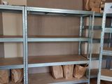 a room that has some shelves and boxes on it