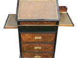 a desk with a drawer and a pen on top of it