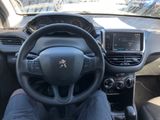 the interior of a car with a steering wheel and dashboard controls