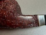 a pipe that has been carved into the shape of a pipe