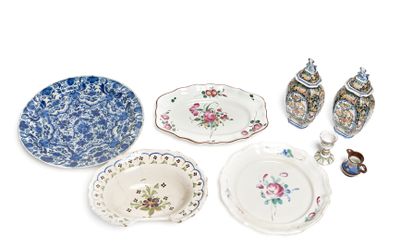 many different types of plates and bowls on the table