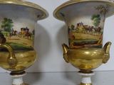 two vases that have been painted with horses on them