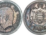 a close up of a coin with a face on it