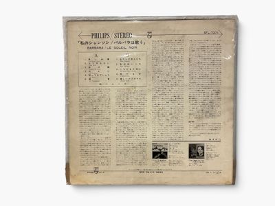 an old newspaper with a picture of a man and a woman on it