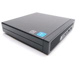the hp desktop computer is on a white surface with a blue sticker on it