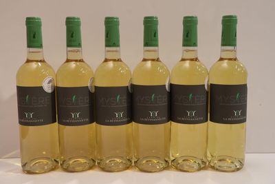six bottles of white wine are lined up on a table