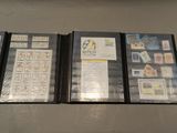 four different types of stamps are on display in a display case
