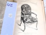 an open book with a drawing of a chair on it