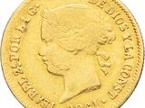 a close up of a gold coin with a woman ' s head on it