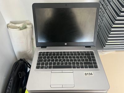 a laptop computer sitting on top of a desk