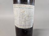 a bottle of wine that is sitting on a table