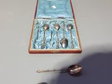 a box with spoons and spoons in it on a table